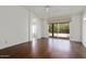 Unfurnished main bedroom with hardwood floors and a sliding glass door at 19102 N 91St St, Scottsdale, AZ 85255
