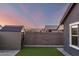 The backyard has an artificial turf area and a storage shed behind a block wall for a clean aesthetic at 19531 W Palo Verde Dr, Litchfield Park, AZ 85340