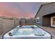 Beautiful backyard with a hot tub, lush artificial grass, and a storage shed at 19531 W Palo Verde Dr, Litchfield Park, AZ 85340