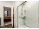Modern bathroom with glass-enclosed shower and neutral color palette at 19531 W Palo Verde Dr, Litchfield Park, AZ 85340