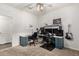 Bedroom with desk, computer setup, and electric guitar at 19531 W Palo Verde Dr, Litchfield Park, AZ 85340