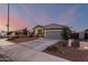 Beautiful gray single Gathering home with well-maintained landscaping and a spacious driveway on a corner lot at 19531 W Palo Verde Dr, Litchfield Park, AZ 85340
