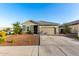 Charming gray single-Gathering home with desert landscaping, spacious driveway and a lovely cactus at 19531 W Palo Verde Dr, Litchfield Park, AZ 85340