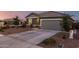 Lovely gray single-Gathering home with desert landscaping, a spacious driveway, and ample parking at 19531 W Palo Verde Dr, Litchfield Park, AZ 85340