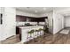 Modern kitchen features stainless steel appliances, granite countertops, and breakfast bar seating at 19531 W Palo Verde Dr, Litchfield Park, AZ 85340