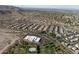 Wide aerial view of Sienna Hills community with community pool, park and Odyssey Preparatory Academy Sienna Hills Campus at 1965 N 213Th Dr, Buckeye, AZ 85396