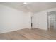 Spacious bedroom with light wood flooring and white trim at 1965 N 213Th Dr, Buckeye, AZ 85396