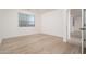 Clean bedroom with light wood floors and window at 1965 N 213Th Dr, Buckeye, AZ 85396