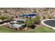 Sienna Hills community park with picnic tables and shade structures surrounded by desert landscape at 1965 N 213Th Dr, Buckeye, AZ 85396