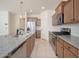 Spacious kitchen featuring stainless steel appliances, granite countertops, and ample cabinet storage at 1965 N 213Th Dr, Buckeye, AZ 85396