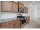 Well-lit kitchen showcasing granite countertops, stainless steel appliances, and stylish backsplash at 1965 N 213Th Dr, Buckeye, AZ 85396