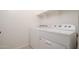 Well-lit laundry room featuring a Whirlpool washer and dryer set at 1965 N 213Th Dr, Buckeye, AZ 85396