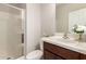 Modern bathroom with glass shower and vanity with white countertop at 19889 W Sherman St, Buckeye, AZ 85326