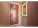 Inviting front entrance featuring a secure door and a cozy, sheltered porch area at 19889 W Sherman St, Buckeye, AZ 85326