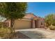 Lovely single-story home with a two-car garage, desert landscaping, and a welcoming facade at 19889 W Sherman St, Buckeye, AZ 85326