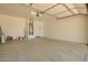 Spacious two-car garage with epoxy flooring and ample room for vehicles and storage at 19889 W Sherman St, Buckeye, AZ 85326