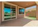 Covered patio offers an excellent outdoor living space with view of the pool and landscaping at 19889 W Sherman St, Buckeye, AZ 85326