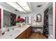 Bathroom offers dual sinks, vanities, mirrors, and a separate makeup area, providing a well-lit and spacious grooming space at 212 Leisure World --, Mesa, AZ 85206