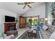 Bright living room with fireplace, vaulted ceiling and access to the outdoor patio at 212 Leisure World --, Mesa, AZ 85206