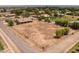 Large lot with potential for development, surrounded by mature trees and residential homes at 22201 E Vallejo St, Queen Creek, AZ 85142
