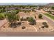 Well-maintained home on a spacious lot with desert landscaping, surrounded by lush greenery and mountain views at 22201 E Vallejo St, Queen Creek, AZ 85142