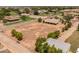 Aerial view of a property with an expansive lot, house, and nearby community amenities at 22201 E Vallejo St, Queen Creek, AZ 85142