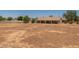 Large backyard offering potential for landscaping or agricultural use, complemented by a covered patio at 22201 E Vallejo St, Queen Creek, AZ 85142