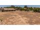 Large backyard offering potential for landscaping or agricultural use, complemented by a covered patio at 22201 E Vallejo St, Queen Creek, AZ 85142