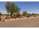Attractive single-story home on a large lot with desert landscaping and mature trees for added privacy at 22201 E Vallejo St, Queen Creek, AZ 85142