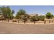 Desert landscaping complements this home featuring a walkway leading up to the entrance with a neutral color palette at 22201 E Vallejo St, Queen Creek, AZ 85142