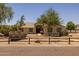 Lovely single-story home featuring desert landscaping, mature trees, and a welcoming walkway to the front door at 22201 E Vallejo St, Queen Creek, AZ 85142