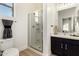 Modern bathroom features a glass-enclosed shower and sleek vanity with sink at 27713 N 57Th Dr, Phoenix, AZ 85083