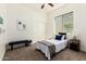 Bright bedroom with stylish decor, comfortable bed, and ample natural light at 27713 N 57Th Dr, Phoenix, AZ 85083