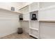Well-organized walk-in closet with ample shelving, hanging space, and neutral decor at 27713 N 57Th Dr, Phoenix, AZ 85083
