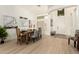 Dining area with modern light fixture, shutters and wood-look floors at 27713 N 57Th Dr, Phoenix, AZ 85083