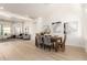 Dining room adjacent to living area with ample seating and stylish decor at 27713 N 57Th Dr, Phoenix, AZ 85083