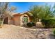 Angle showing attractive low-maintenance landscaping and architectural style at 27713 N 57Th Dr, Phoenix, AZ 85083