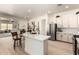 Spacious kitchen with stainless steel appliances, island and white cabinets at 27713 N 57Th Dr, Phoenix, AZ 85083