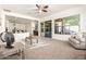 Bright living room with plush seating, view to the kitchen and sliding glass door at 27713 N 57Th Dr, Phoenix, AZ 85083