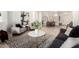 Bright living room featuring elegant decor and wood-look flooring at 27713 N 57Th Dr, Phoenix, AZ 85083