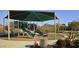 Community playground with play structures, shaded seating and a picnic area at 27713 N 57Th Dr, Phoenix, AZ 85083