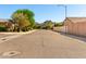 Picturesque street view showcasing the community's well-maintained homes and mountain backdrop at 27713 N 57Th Dr, Phoenix, AZ 85083
