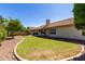 Picture of backyard featuring lush greenery, attractive landscaping, and a relaxing patio at 319 N Riata St, Gilbert, AZ 85234