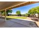 View of the well-maintained backyard with lush green grass and mature landscaping at 319 N Riata St, Gilbert, AZ 85234