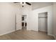 Bedroom featuring light wood flooring, a closet, and an open doorway at 319 N Riata St, Gilbert, AZ 85234