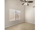 Bright bedroom showcases light wood flooring and a large window at 319 N Riata St, Gilbert, AZ 85234