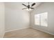 Bedroom with light wood flooring, a ceiling fan, and a window at 319 N Riata St, Gilbert, AZ 85234