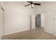 Bedroom featuring light wood flooring, ceiling fan, and closet at 319 N Riata St, Gilbert, AZ 85234