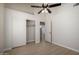 Bedroom features closet, ceiling fan, and light wood flooring at 319 N Riata St, Gilbert, AZ 85234