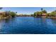 Scenic lake view within the community, featuring calm waters reflecting the surrounding homes at 319 N Riata St, Gilbert, AZ 85234
